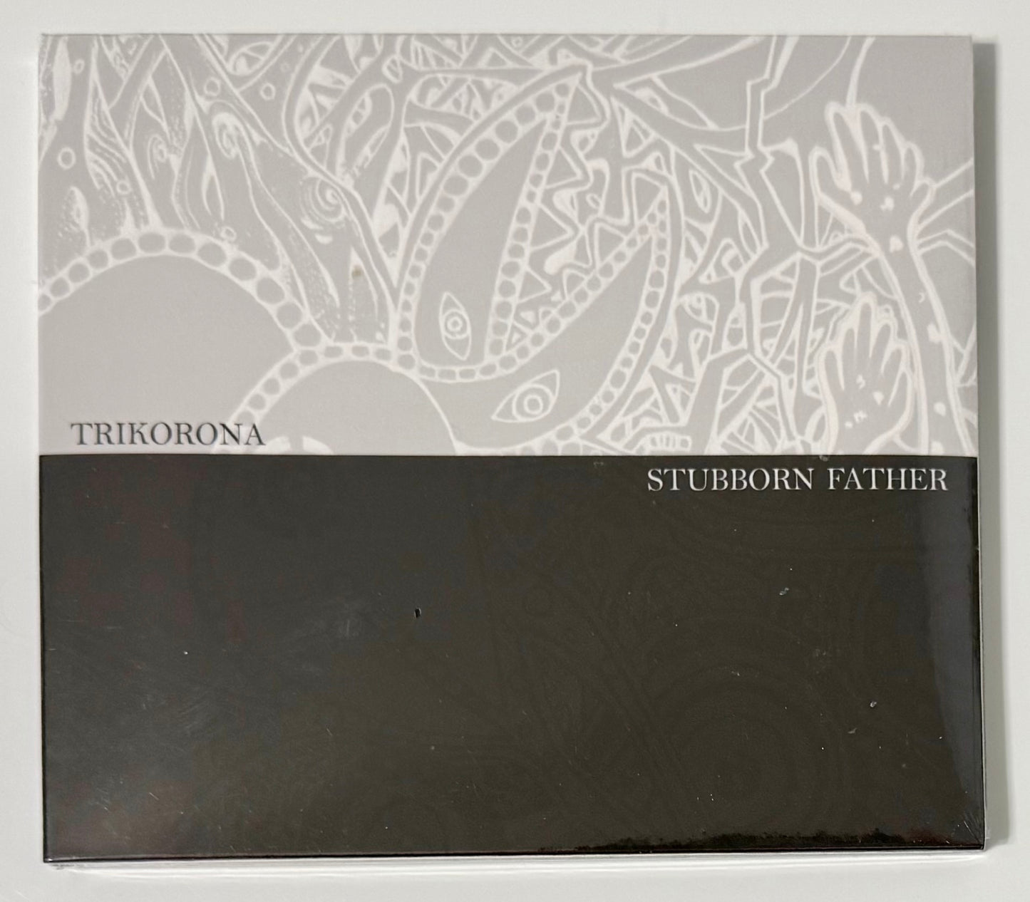 Stubborn Father / Trikorona split CD